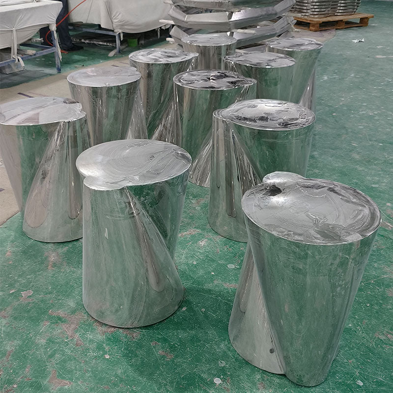 Polished stainless steel sofa side table