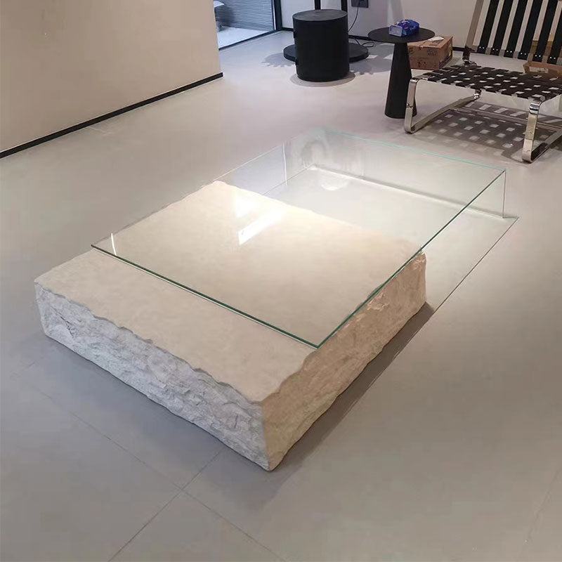 Rectangular glass and rock coffee table