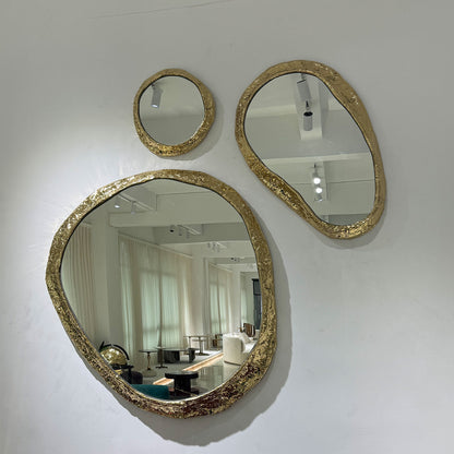 three different-size mirrors