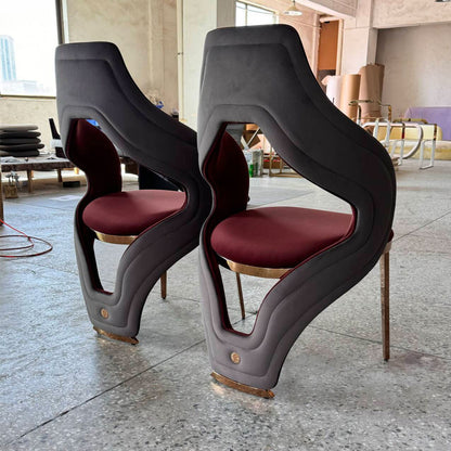 Luxury sculptural velvet chair with openwork curved gold legs - designer chair