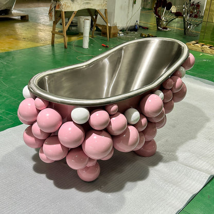 Luxury bathroom with modern adult 1.8m pink freestanding bubble bath.