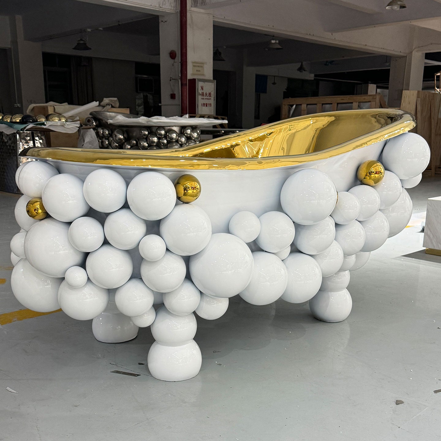 Custom modern luxury bathroom bathtub with white bubble balls and a gold interior freestanding bathtub