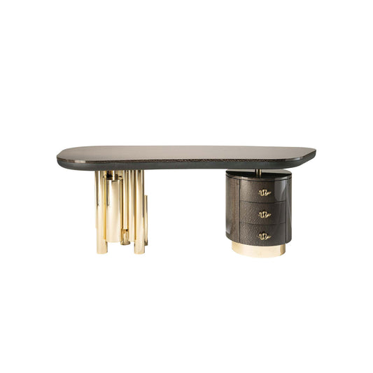 Antigua sculptural luxury desk featuring gold tubular legs and serpentine handles