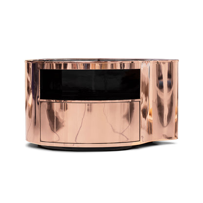 Rose gold stainless steel bedside table with a curved design, perfect for a luxurious bedroom.